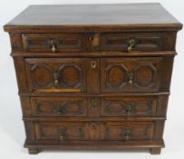 A late 17th century oak chest of four graduated drawers with geometric moulded drawer fronts