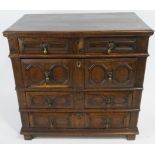 A late 17th century oak chest of four graduated drawers with geometric moulded drawer fronts