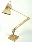 A Herbert Terry Anderson anglepoise lamp, finished in cream and set on a stepped base,