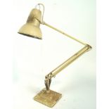 A Herbert Terry Anderson anglepoise lamp, finished in cream and set on a stepped base,