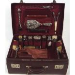 A Morocco red leather ladies travelling dressing case, lined with moire silk,