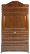 A Biedermeier mahogany bureau with the panelled fall front enclosing a selection of drawers