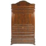 A Biedermeier mahogany bureau with the panelled fall front enclosing a selection of drawers