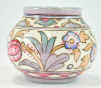 A Charlotte R Head pottery globular vase, with tube lined flowers, factory marks,