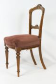 A set of six Victorian salon chairs, each with boxwood and walnut inlay with stuff-over seats,