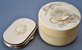 A 19th century Japanese two piece round ivory box, the pull off lid engraved with three lions,