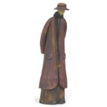 A Howard Charles Masham pottery sculptural figure of an elongated figure wearing a hat,
