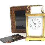A brass cased carriage timepiece with platform lever escapement, in a brown leather case,