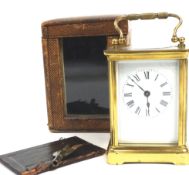 A brass cased carriage timepiece with platform lever escapement, in a brown leather case,
