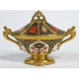 A Royal Crown Derby Imari pattern urn shaped vase and cover, 20th century printed red marks,