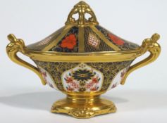 A Royal Crown Derby Imari pattern urn shaped vase and cover, 20th century printed red marks,