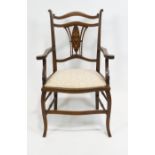 An Edwardian mahogany small salon armchair,