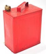 A metal motor spirit can (un-branded), with brass cap, finished in red,