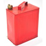 A metal motor spirit can (un-branded), with brass cap, finished in red,