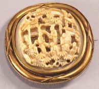 A 19th century yellow metal brooch, of rounded square form, set applied wire work decoration,