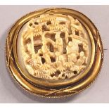 A 19th century yellow metal brooch, of rounded square form, set applied wire work decoration,