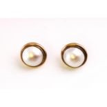 A large pair of yellow metal stud earrings each set with a 14.0mm mabe pearl.