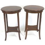 A pair of Edwardian occasional tables, of rounded form,