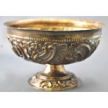 A small silver hemispherical bowl,