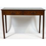 An Edwardian mahogany ladies writing table with leather inset top,