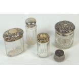 A group of five silver and white metal cut glass dressing jars, two gilt finish, two un-marked,