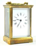 A carriage timepiece, with brass four glass case, enclosing an enamel dial,