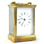 A carriage timepiece, with brass four glass case, enclosing an enamel dial,