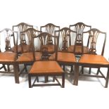 A set of eight mahogany dining chairs in George III style, with pierced and wheat sheaf splats,