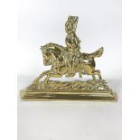 A brass door stop cast as a military figure on horseback, on a stepped plinth