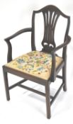 A mahogany elbow chair, in George III style, with pierced splat and drop in tapestry seat,