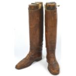 A pair of early 20th century brown leather Royal Horse Artillery Officer's boots and wooden lasts