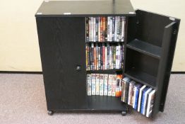 A quantity of DVD's in a cabinet