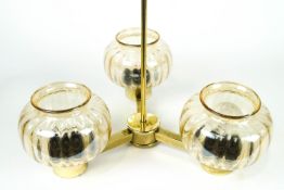 A pair of three light hanging pendant lights,