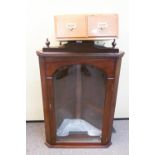 A mahogany corner cupboard and a set of drawers