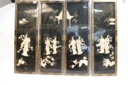 Four Asian carved mother of pearl and lacquer wall panels