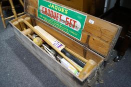 A boxed Jacques croquet set and a cricket bat