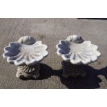 A pair of cast bird baths