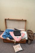 A suitcase containing curtains and cushions