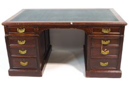 A Victorian mahogany kneehole desk