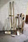 A collection of tools and walking sticks