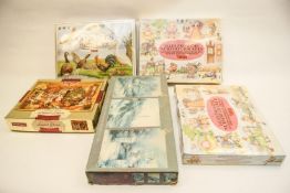 Two boxed jigsaw puzzles and some crackers