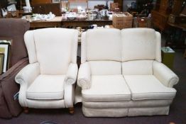 A Parker Knoll two seater sofa and a reclining chair