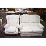 A Parker Knoll two seater sofa and a reclining chair