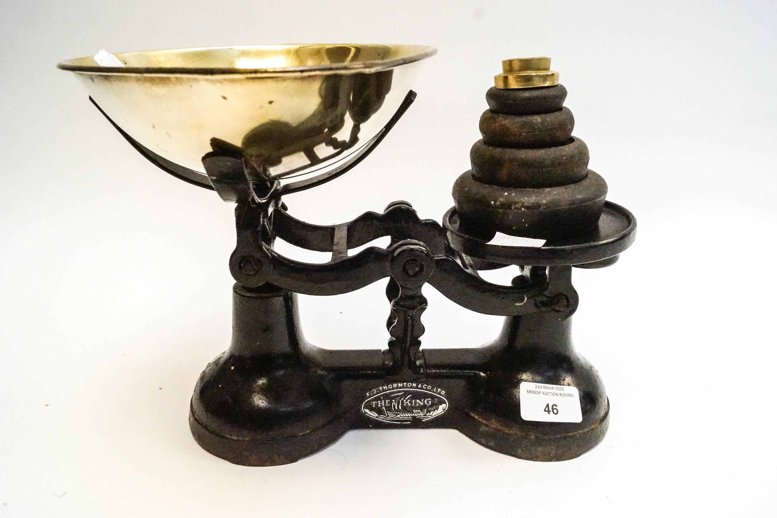 A set of vintage cast iron scales with weights