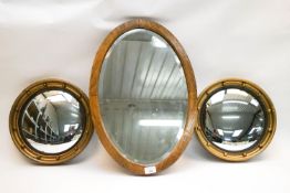 Three mirrors (two round and one oval)