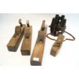 Four wood planes and a pair of binoculars