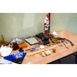 Collection of miscellaneous items including tape measures and desk items