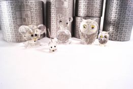 Five Swarovski glass figures : a bear, 7cm high, an owl, 6cm high, an owl, 3.5cm high, a mouse, 2.