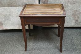 An antique inlaid stool