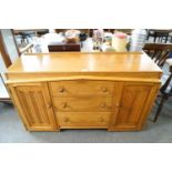 An oak linen fold cupboard